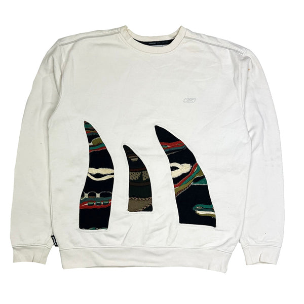 Vintage reworked Reebok x COOGI Sweatshirt in white with logo to chest. Crewneck. - Colour: White Condition: Good  some marks to sweatshirt  - Size on Tag: Small Measurements: Pit to Pit: 21.5 Inches Length: 25 Inches  All our items are of vintage conditions. This means some items may show signs of minor wear. Any major defects will be pictured and/or stated in the description. We recommend to wash all vintage items before use.