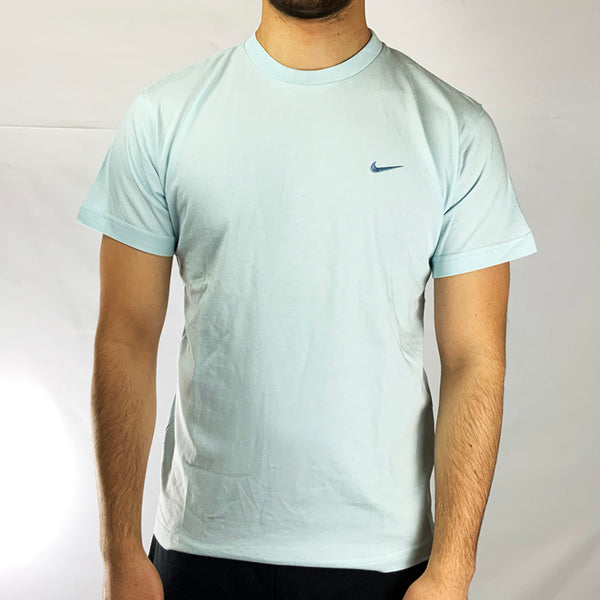 Y2k Boys Deadstock Vintage Nike Swoosh T-shirt in Blue is perfect fit for adult small. Embroidered Nike swoosh branding on chest.  Colour: Blue  Brand New with Tags  Size on Tag: Boys XL (fits adult small)  Pit to Pit: 19 inches  Length: 27 inches  All our items are of vintage conditions. This means some items may show signs of minor wear. Any major defects will be pictured and stated in the description