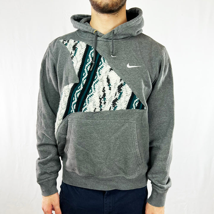 Vintage reworked Nike x COOGI Hoodie in dark grey with logo to chest. Drawstrings to hood. Pocket to front. - Colour: Dark Grey Condition: Good  - Size on Tag: Large Measurements: Pit to Pit: 23 Inches Length: 24 Inches