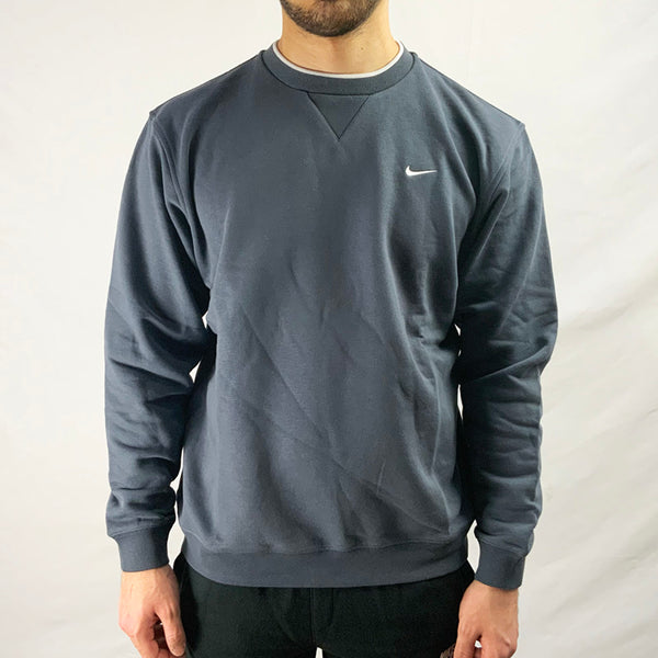 2003 Deadstock Vintage Nike Swoosh Sweatshirt in Grey. Embroidered Nike swoosh logo to chest and white detailing to neckline. Cosy comfortable feel.   Colour: Grey  Brand New with Tags  Size on Tag: Boys XL (fits adult small)  Pit to Pit: 22.5 Inches  Length: 25.5 Inches  All our items are of vintage conditions. This means some items may show signs of minor wear. Any major defects will be pictured and stated in the description