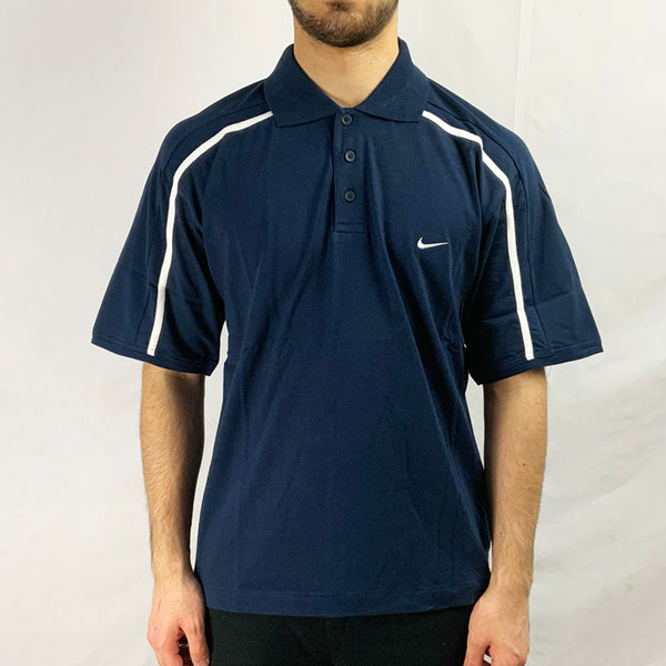 2004 Deadstock Vintage Nike Polo T-shirt in Navy Blue with embroidered Nike swoosh to chest. White detailing. Colour: Navy Blue  Brand New with Tags  _  Size on Tag: Medium  Measurements:  Pit to Pit: 20.5 Inches  Length: 27 Inches  All our items are of vintage conditions. This means some items may show signs of minor wear. Any major defects will be pictured and stated in the description