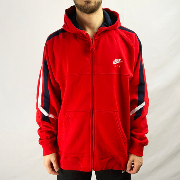 2005 Deadstock Vintage Nike Air Sporting Excellence Hoodie in Red. Embroidered Nike Air logo to chest, white and navy detailing. Pockets to side. Full zip closure. Drawstrings to hood.   Colour: Red  Brand New with Tags  Size on Tag: XL  Pit to Pit: 26.5 Inches  Length: 29 Inches  All our items are of vintage conditions. This means some items may show signs of minor wear. Any major defects will be pictured and stated in the description