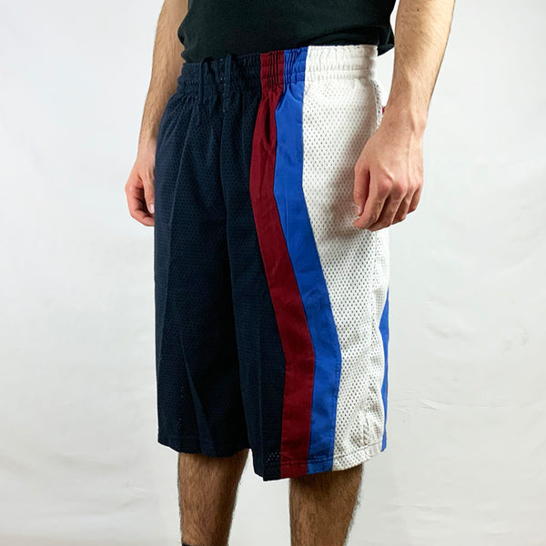 2006 Deadstock Vintage Nike FORCE Basketball Shorts in Navy Blue with embroidered Nike branding to side. White, Burgundy and Blue detailing. Mesh look. Adjustable drawstrings to waist. Colour: Navy Blue  Brand New with Tags  -  Size on Tag: Medium  Measurements:  Length: 24 Inches  Waist: GB 31/33 Adjustable drawstrings  All our items are of vintage conditions. This means some items may show signs of minor wear. Any major defects will be pictured and stated in the description