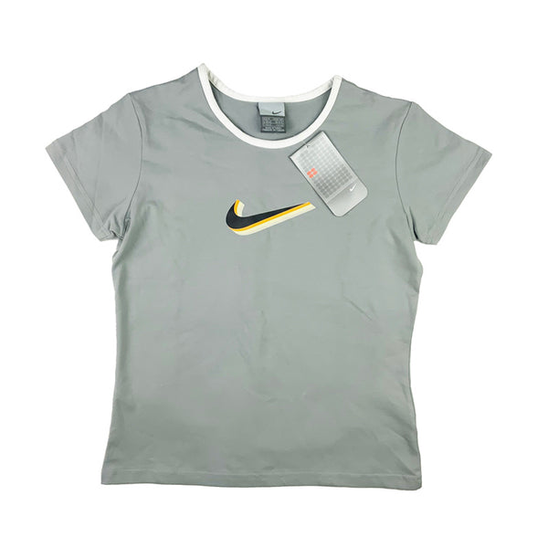 2002 Women's Deadstock Vintage Nike Swoosh T-shirt in Grey with Nike swoosh across chest. Colour: Grey  Brand New with Tags  _  Size on Tag: Medium  Measurements:  Pit to Pit: 16.5 Inches  Length: 21.5 Inches  All our items are of vintage conditions. This means some items may show signs of minor wear. Any major defects will be pictured and stated in the description