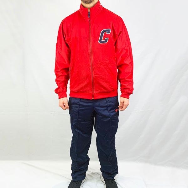 2003 Deadstock Vintage Nike Cortez tracksuit set in red and navy blue. Full zip closure and pockets available on track top. The matching pants in navy blue has an adjustable drawstring for a customised wear, as well as side pockets to keep your essentials. Nike Cortez branding detailed on track top and track bottoms.  Colour: Red and navy blue  Brand New with Tags  Size on Tag: Large