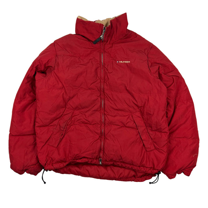 Y2K Vintage Tommy Hilfiger puffer jacket in red. Tommy Hilfiger swoosh branding to chest and behind neck. Pockets to front. Zip closure to jacket. Down filled. Adjustable cord to waist. - Colour: Red Condition: Good - minor mark to jacket as seen in image - Size on Tag: Medium Measurements: Pit to Pit: 24.5 Inches Length: 26 Inches