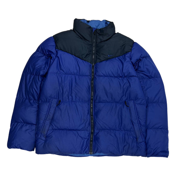 Y2K Vintage Nike swoosh puffer jacket in navy blue. Nike swoosh branding to chest. Zip pockets to front. Zip closure to jacket. Down filled. - Colour: Navy Blue Condition: Good - some minor marks to jacket as seen in images - Size on Tag: Medium Measurements: Pit to Pit: 23.5 Inches Length: 28 Inches